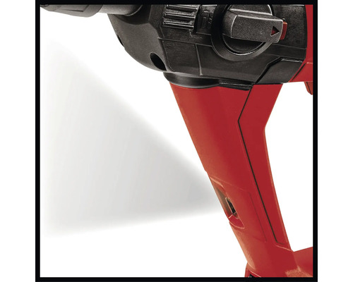 Detailný záber vŕtačky s červeným krytom a čiernym ovládacím prvkom