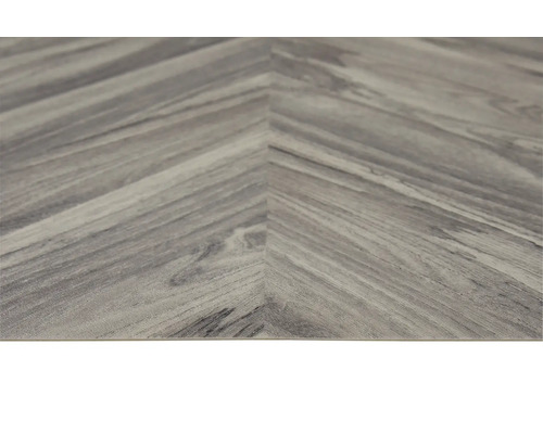 Detail vinylovej podlahy so vzorom rybej kosti.