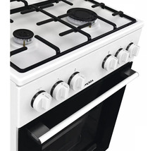 Plynový sporák Mora s ovládacími gombíkmi a čiernou rúrou