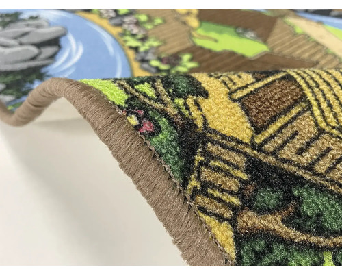 Detailný pohľad na koberec s motívom krajiny