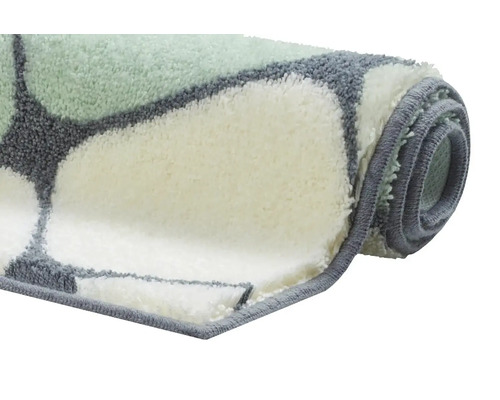 Zrolovaná kúpeľňová rohož s geometrickým vzorom