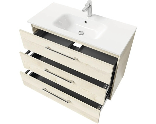 Skrinka pod umývadlo s tromi otvorenými zásuvkami a umývadlom