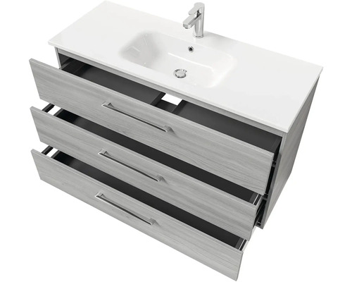 Skrinka pod umývadlo s tromi otvorenými zásuvkami, umývadlom a batériou