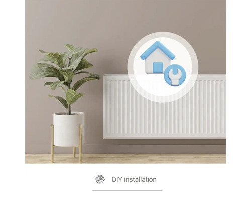 Radiátor s rastlinou a symbolom pre inštaláciu svojpomocne