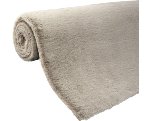 Zrolovaný koberec z textilného materiálu