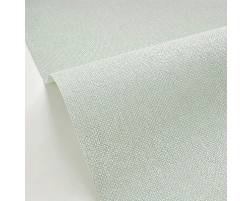 Detailný záber rolky tapety s jemnou textúrou