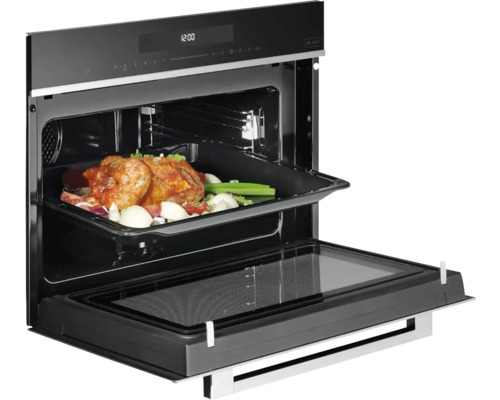 Rúra s otvorenými dvierkami a pečené mäso vo vnútri