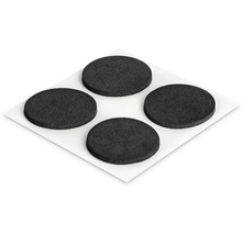 Štyri okrúhle klzáky na nábytok na liste