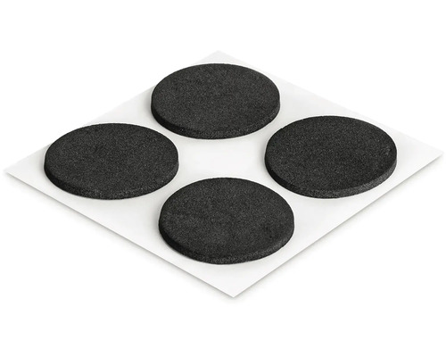 Štyri okrúhle klzáky na nábytok na liste