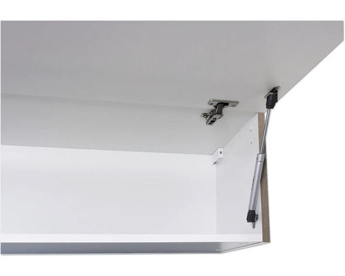 Detail otvorenej skrinky s pántom a plynovou vzperou