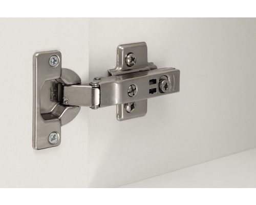 Kovový nábytkový pánt na bielom povrchu