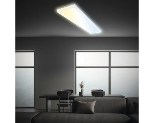 LED panel Briloner SLIM 36 W 4800 lm 2700-6500 K 98 x 20 cm biely s diaľkovým ovádaním Moderná obývacia izba s minimalistickým dizajnom, jedálenským stolom a plochým stropným svietidlom