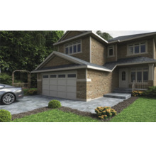 Obrázok dvojpodlažného domu s garážou, kamenným schodiskom a dláždenou príjazdovou cestou.