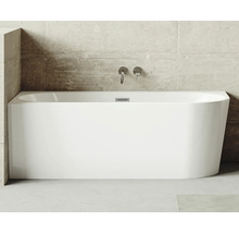 Obdĺžniková vaňa zo sanitárneho akrylátu s armatúrami na betónovej stene