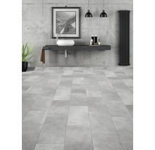 Moderná kúpeľňa s umývadlom, umývadlovou misou, radiátorom a dlažbou.