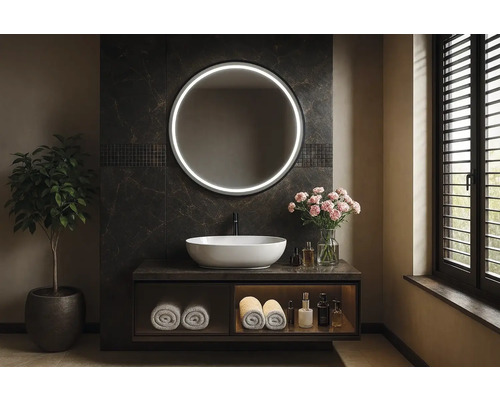 Kúpeľňa s okrúhlym zrkadlom s osvetlením, umývadlom a rastlinou