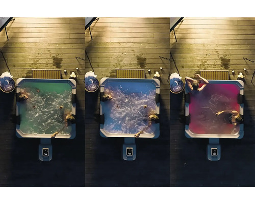 Tri vírivky na drevenej terase s kúpajúcimi sa a farebným osvetlením.