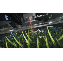 Detailný pohľad na kosačku na trávu s ukazovateľom výšky kosenia medzi nulou a desiatimi centimetrami