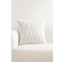 Dekoračný vankúš so vzorom na pohovke