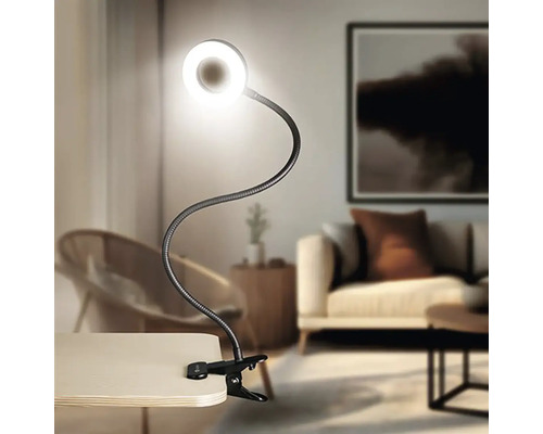 Svietidlo s klipom, flexibilným ramenom a kruhovým LED svetlom na stole