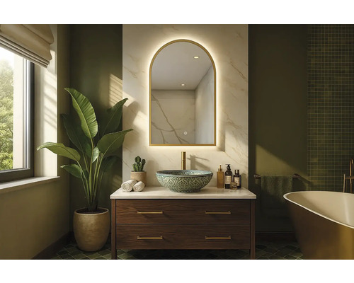 Kúpeľňa s umývadlom, zrkadlom a rastlinou pre svetlé a priestranné prostredie.