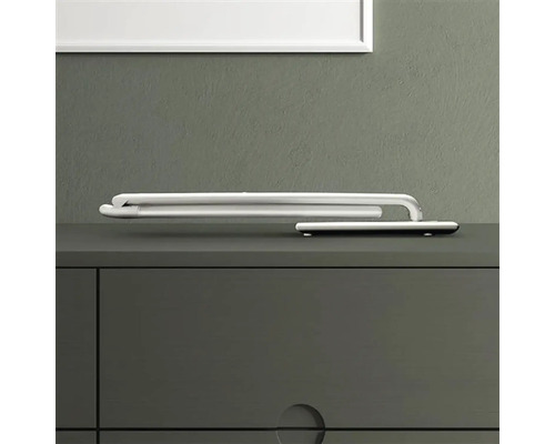 Zložený držiak na uteráky na komode