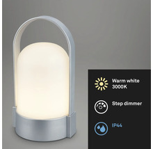 Prenosná LED stolná lampa so strieborným telom a rukoväťou, teplé biele svetlo 3000 Kelvinov, stupňovitý stmievač a stupeň krytia IP44.