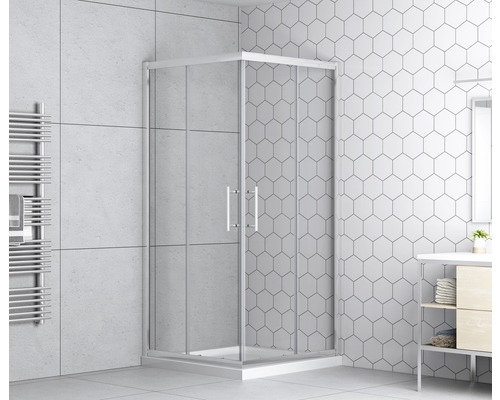 Rohová sprcha so sklenenými dverami v kúpeľni s obkladmi