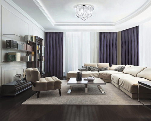 Obývacia izba s pohovkou, kreslom, knižnicou a stropným svietidlom