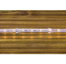 LED svetelný had s držiakom na drevenom pozadí