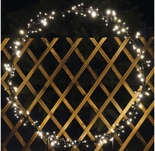 Kruhová svetelná reťaz s mnohými malými svetlami na drevenom plote