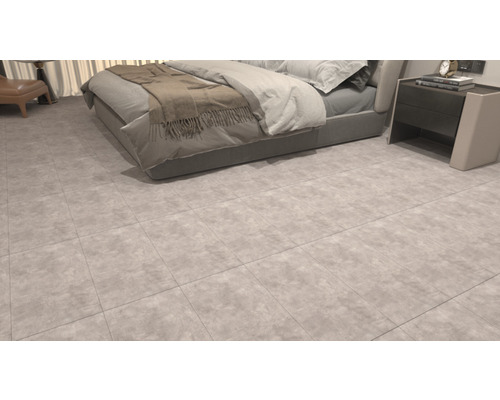 Podlahové dlaždice v spálni s posteľou a nočným stolíkom