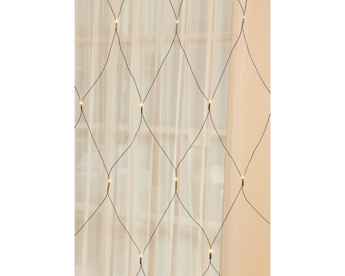 Svetelná reťaz v sieťovom dizajne pred oknom