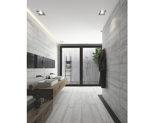 Moderná kúpeľňa s dvojitým umývadlom, sivými obkladmi a sprchovacím kútom.