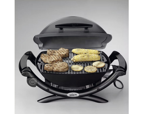 Elektrický gril s grilovanými potravinami, ako sú kukuričné klasy a mäso