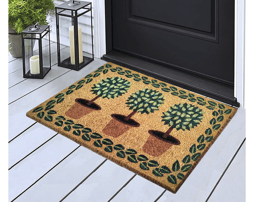 Rohožka s motívom stromu v kvetináči pred vchodovými dverami