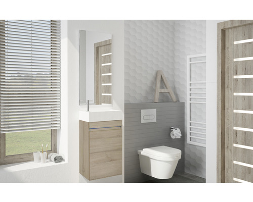 Moderná kúpeľňa s umývadlom, zrkadlovou skrinkou, toaletou a radiátorom