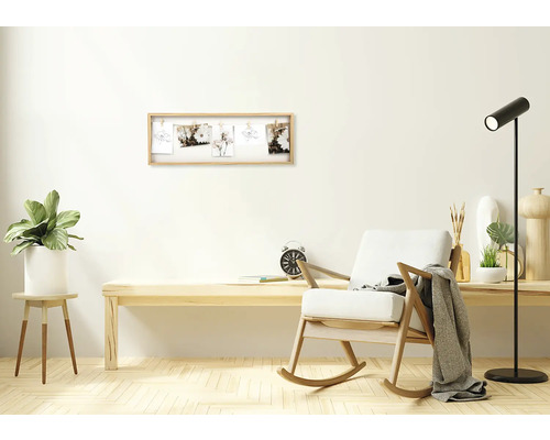 Obývacia izba s dreveným hojdacím kreslom, stolom a rámom na fotografie