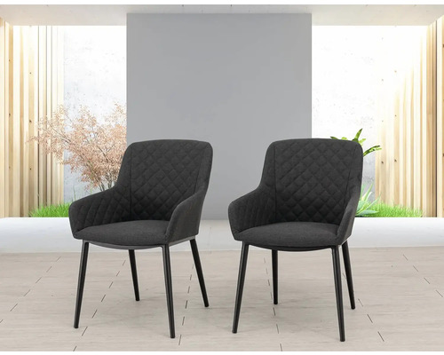 Dve kreslá s prešívaným povrchom a kovovými nohami.