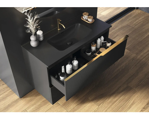 Čierne umývadlo s otvorenou zásuvkou, batériou a umývadlom