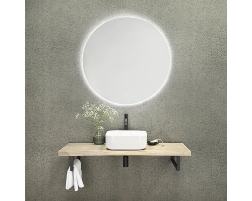 Kúpeľňa s okrúhlym zrkadlom, umývadlovou doskou a umývadlom na dosku