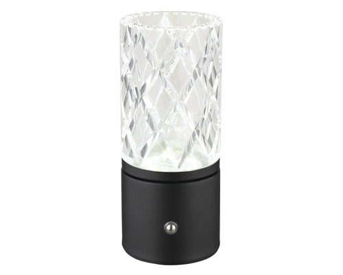 Dekoratívna stolná lampa s čírym, brúseným skleneným valcom a čiernou základňou.