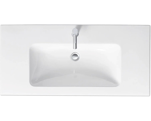 Pohľad zhora na umývadlo na dosku s vodovodnou batériou a výpustným ventilom