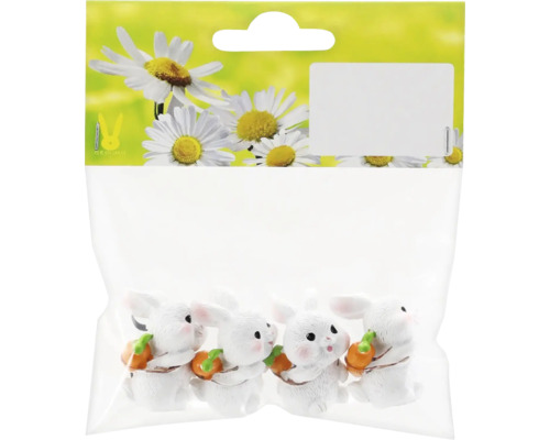 Sada dekoratívnych králičích figúrok, balené na predaj.