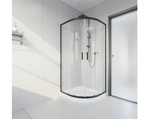 Rohová sprcha s čiernym rámom v svetlej kúpeľni.