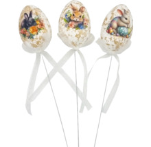 Tri dekoratívne veľkonočné vajíčka s motívmi zajačikov, stuhy a stonky na veľkonočné dekorácie