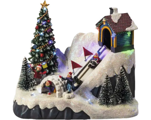 Vianočná miniatúrna dedina s vianočným stromčekom, iglu a sánkarskou dráhou