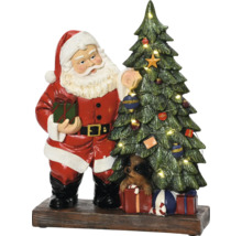 Santa Claus s vianočným stromčekom a psom na darčekoch