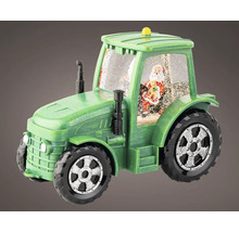 Zelený traktor ako snehová guľa s figúrkou Santa Clausa