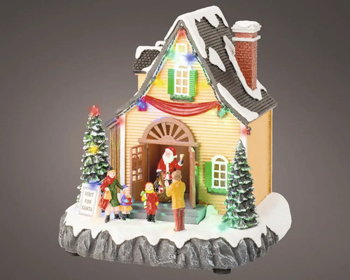 Vianočná dekorácia osvetlený dom so Santa Clausom a deťmi